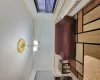 Living room featuring a chandelier, a textured ceiling, radiator, and crown molding