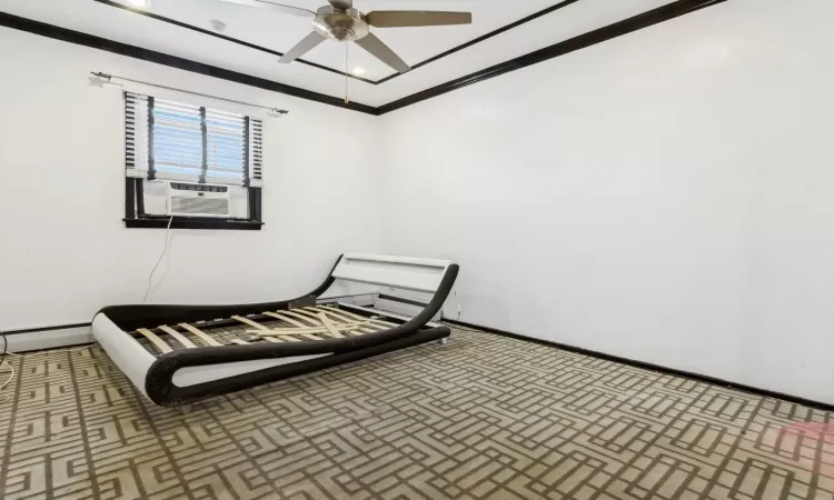 Bedroom featuring carpet, baseboard heating, cooling unit, crown molding, and ceiling fan