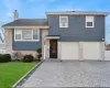 Split level home featuring a garage