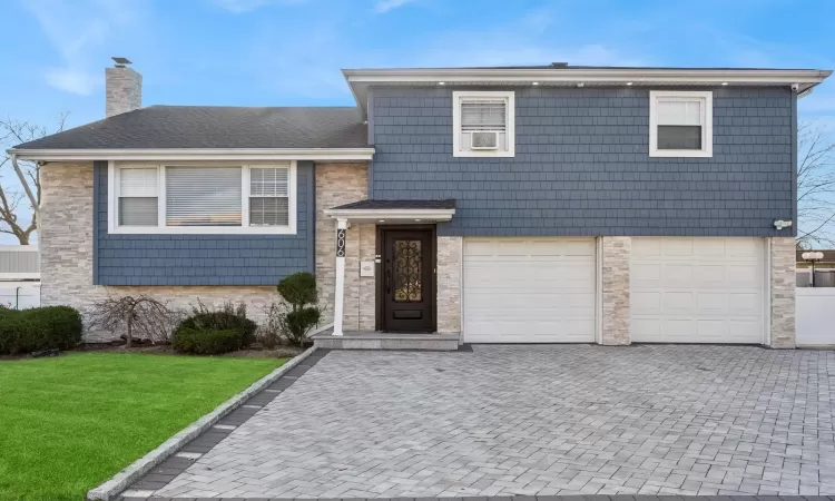 Split level home featuring a garage