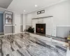 Living room featuring a fireplace and ornamental molding