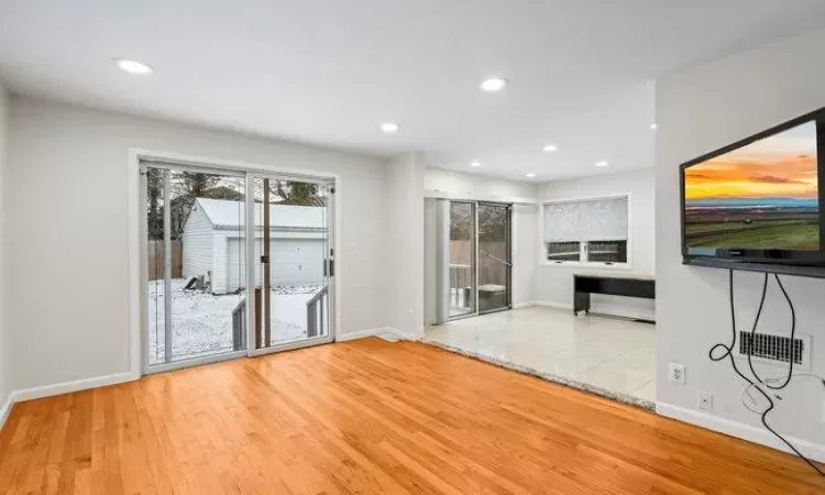 Unfurnished living room featuring light wood-type flooring