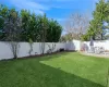 View of yard featuring a storage shed and a patio