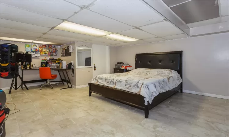 Bedroom featuring a drop ceiling