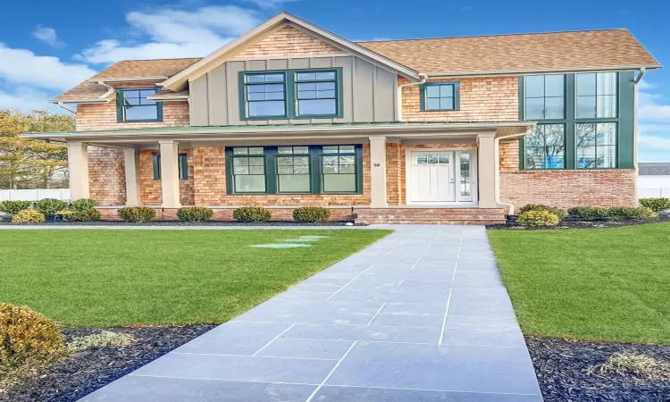 Craftsman-style house with a front lawn