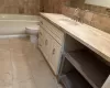 Bathroom with tasteful backsplash, tile patterned floors, a bathtub, vanity, and toilet