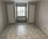 Unfurnished room featuring an AC wall unit and ornamental molding