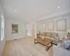 Living room with light hardwood / wood-style flooring