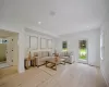 Living room with light wood-type flooring