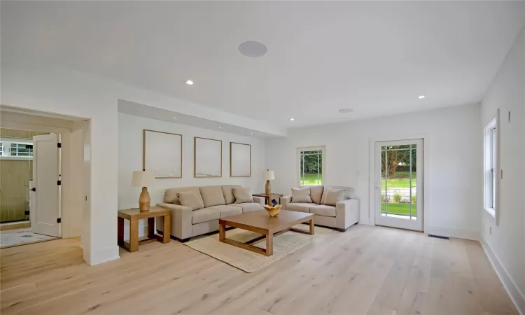 Living room with light wood-type flooring