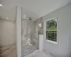 Bathroom with a shower with shower door