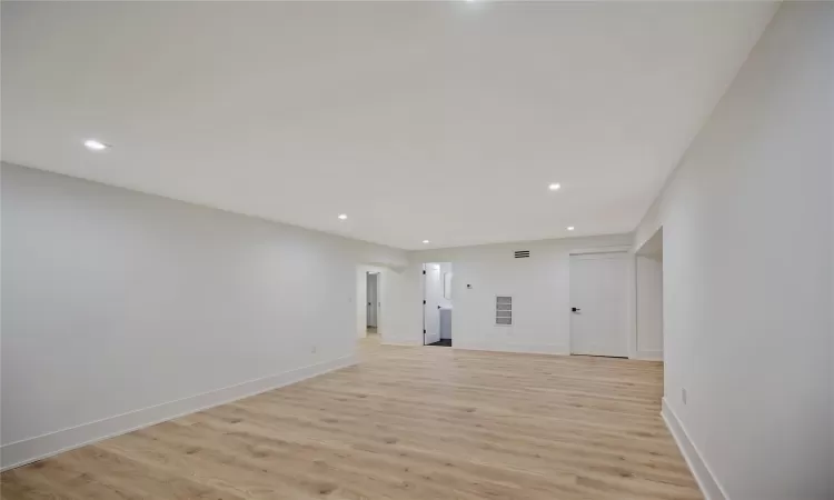 Empty room featuring light wood-type flooring