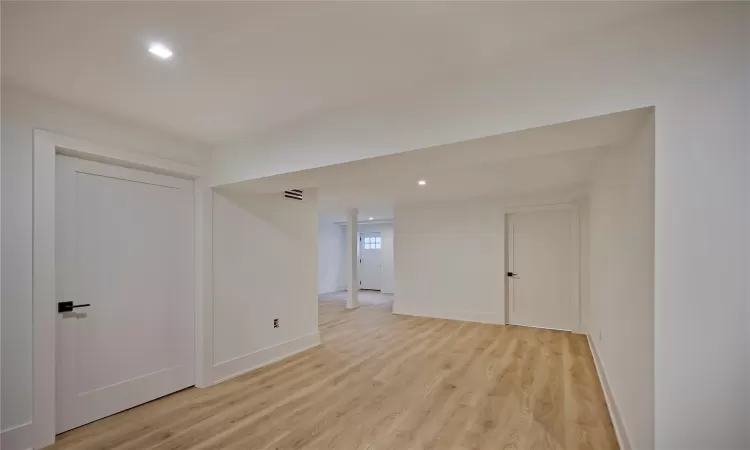 Unfurnished room with light hardwood / wood-style flooring