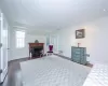 Living area featuring a fireplace, a baseboard heating unit, radiator heating unit, and dark wood-type flooring