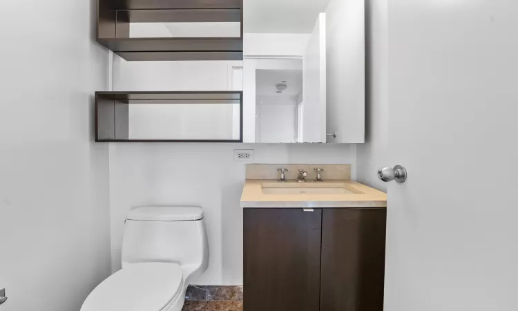 Bathroom with vanity and toilet