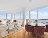 Sunroom / solarium with a water view and a wealth of natural light