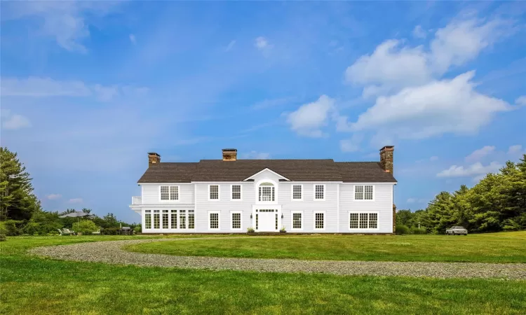 View of front of property with a front lawn