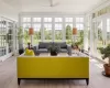 Sunroom with ceiling fan and french doors