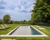 View of pool featuring a yard