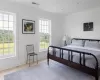 Bedroom featuring light tile patterned floors and ornamental molding