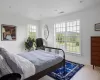 Bedroom with crown molding and light hardwood / wood-style floors