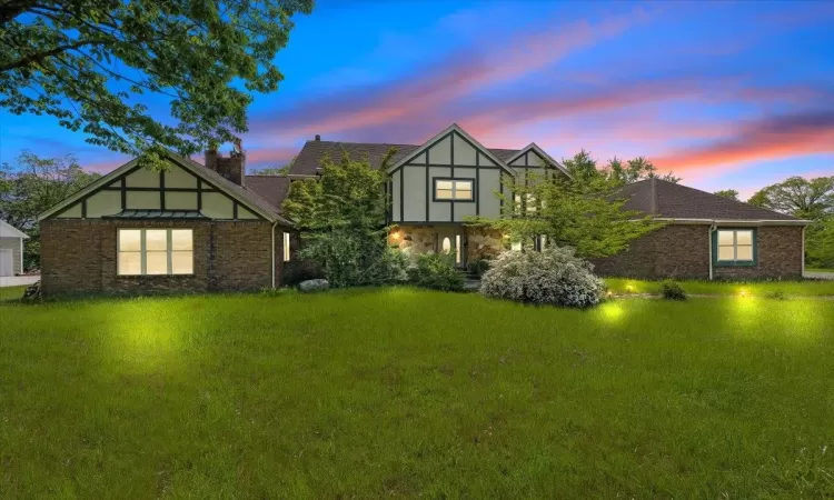 View of front of home featuring a yard