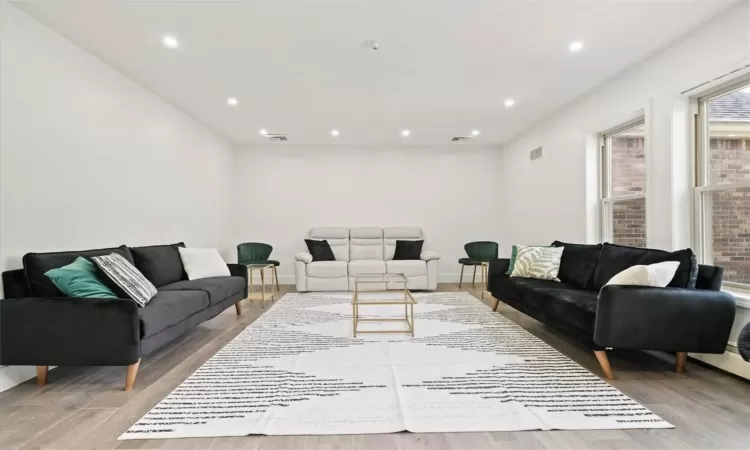 Living room with light hardwood / wood-style floors