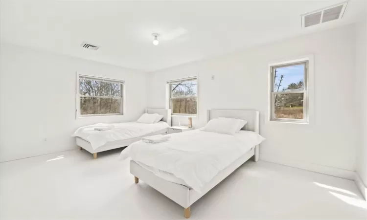 Bedroom with multiple windows