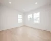 Bedroom featuring light hardwood flooring