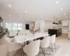 Virtually Staged Dining area featuring light hardwood flooring