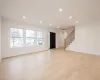 Unfurnished living room featuring light hardwood floors