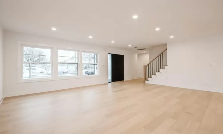 Unfurnished living room featuring light hardwood floors