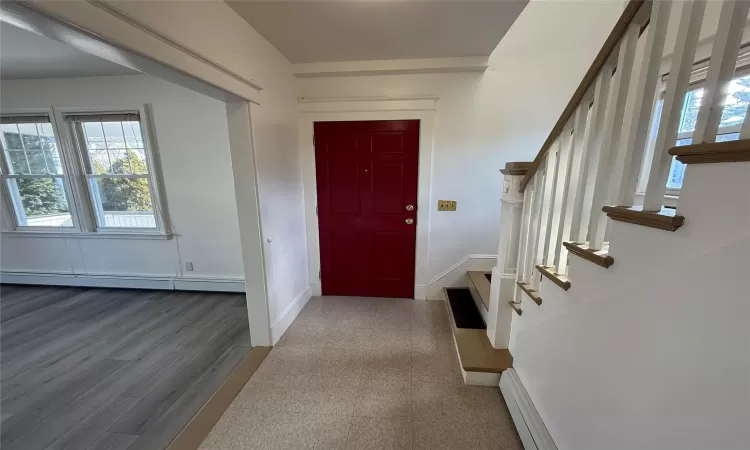 Entrance foyer with a baseboard radiator