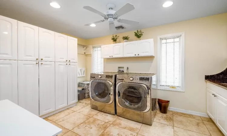 Bathroom featuring vanity and tile walls