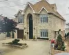 View of property featuring french doors and a garage