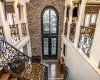 Foyer featuring french doors, a high ceiling, and a wealth of natural light