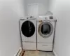 Washroom with washing machine and clothes dryer