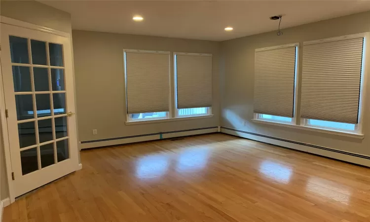 Spare room with light wood-type flooring