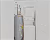 Clothes washing area with electric water heater and stacked washer / dryer