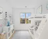 Staged Bedroom featuring light wood-type flooring