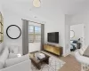 Staged Living room with light hardwood / wood-style flooring