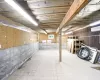 Basement featuring a wall unit AC