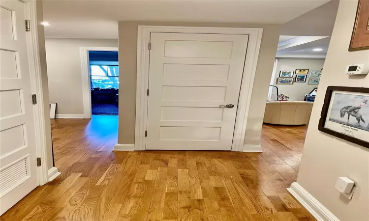 Corridor featuring light wood-type flooring