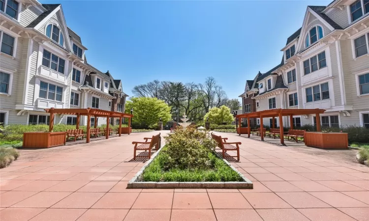 View of community featuring a pergola and a patio