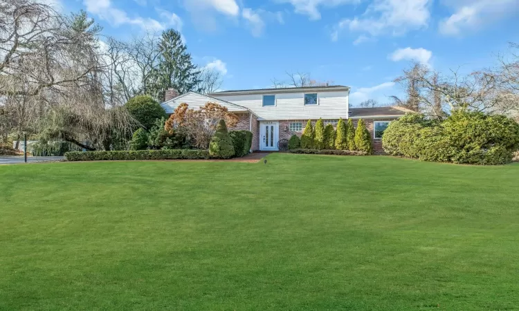 View of front of house with a front lawn