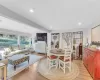 Dining space featuring light hardwood / wood-style floors and vaulted ceiling