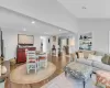 Living room with dark hardwood / wood-style floors and vaulted ceiling