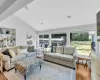 Living room featuring lofted ceiling and light wood-type flooring