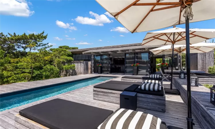 View of swimming pool featuring a deck