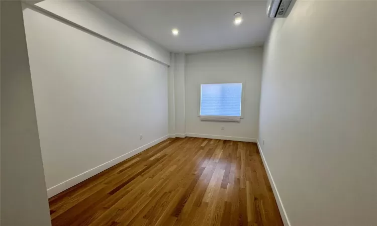 Empty room featuring hardwood / wood-style flooring